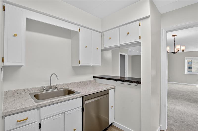 5 Bayard Road, Unit 500 Pittsburgh, PA 15213 - Photo 7 of 20 a kitchen with granite countertop a sink and cabinets