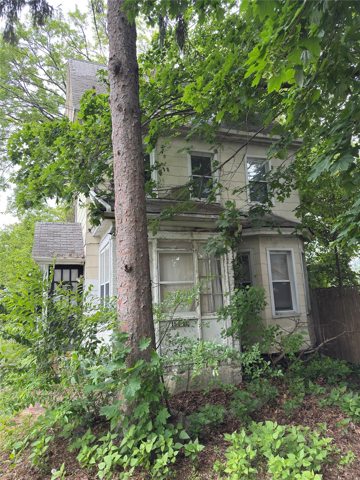 154-21 Ash Avenue Queens, NY 11355 - Photo 5 of 5 a front view of a house with garden