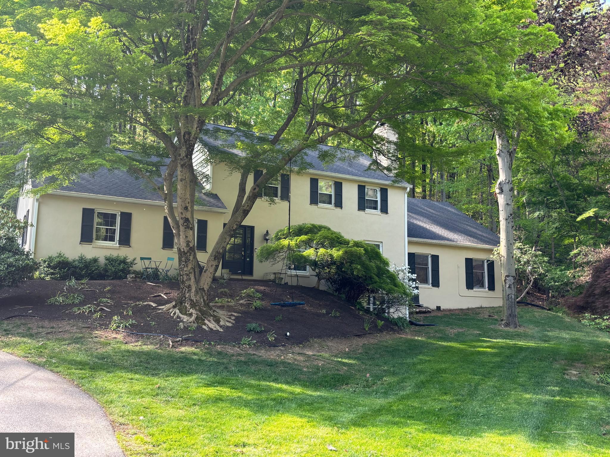 749 Mancill Road Wayne, PA 19087 - Photo 1 of 34 a front view of a house with a garden