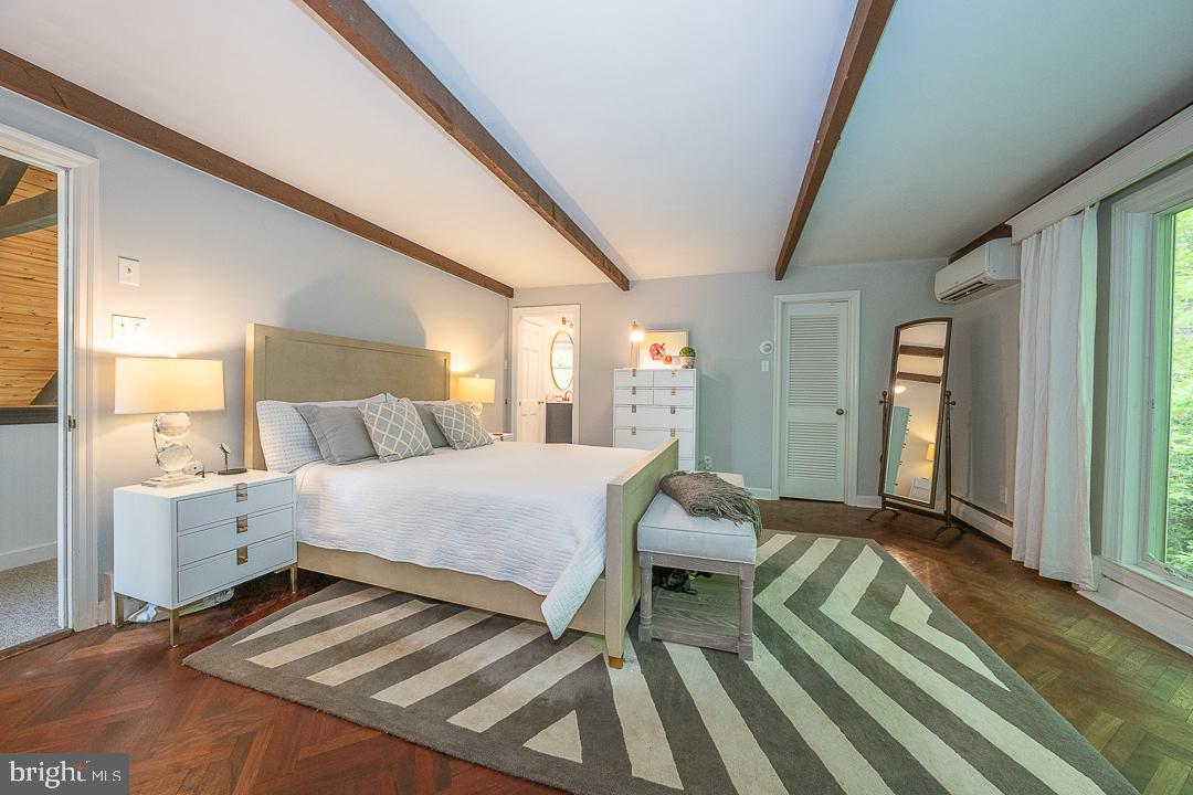 749 Mancill Road Wayne, PA 19087 - Photo 20 of 34 a bedroom with a bed and wooden floor
