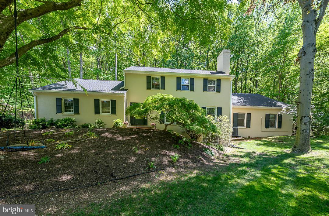 749 Mancill Road Wayne, PA 19087 - Photo 2 of 34 a front view of a house with a garden