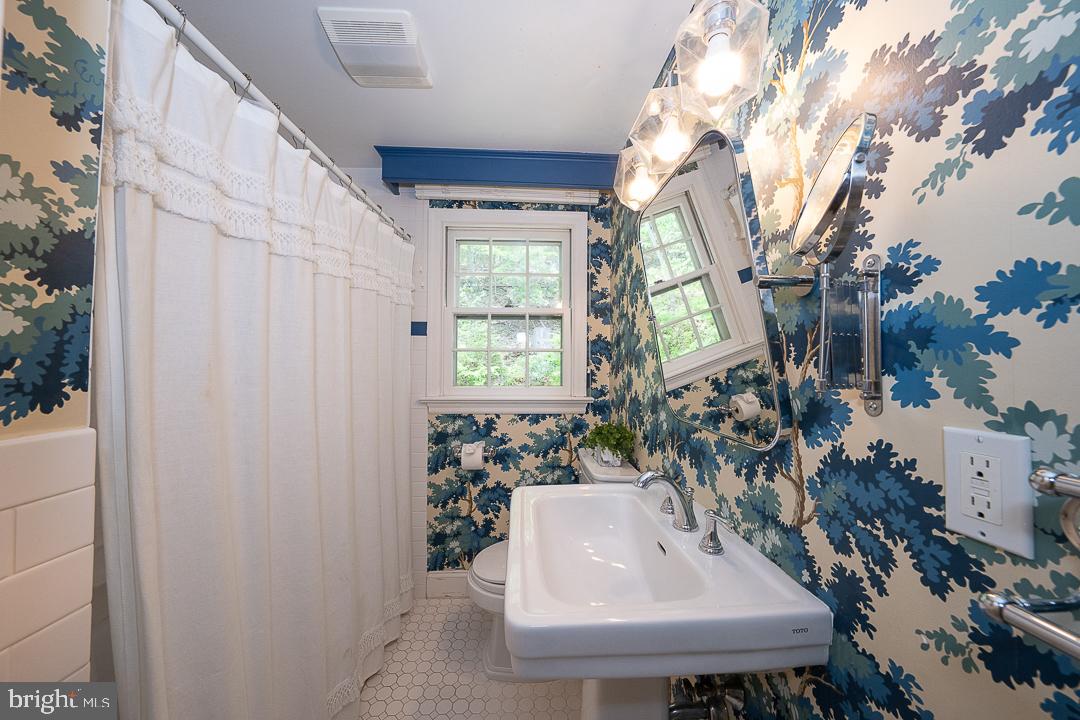 749 Mancill Road Wayne, PA 19087 - Photo 25 of 34 a bathroom with sink and mirror