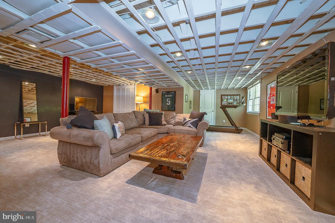 749 Mancill Road Wayne, PA 19087 - Photo 30 of 34 a living room with furniture and a flat screen tv