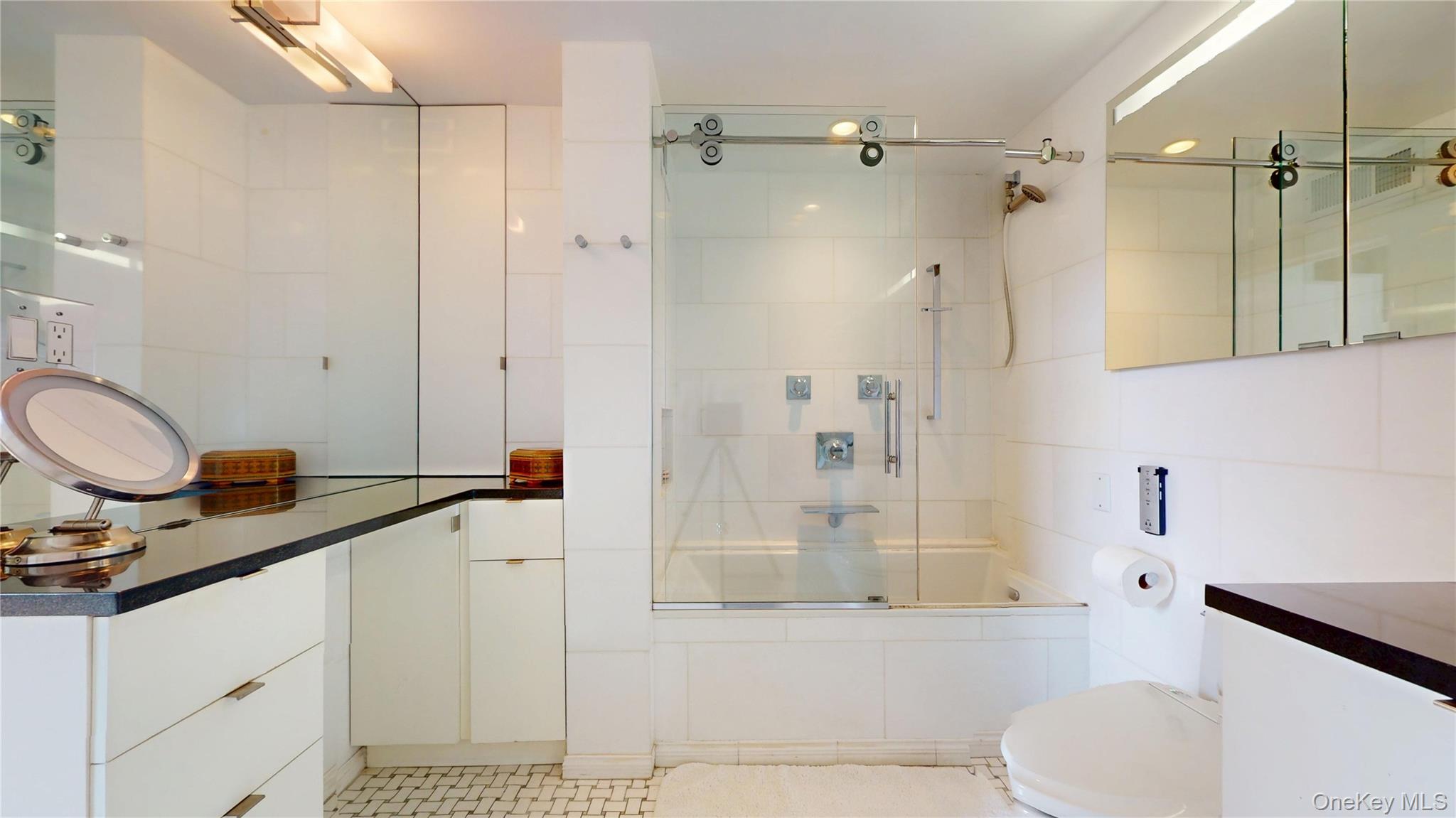 1255 5th Avenue Manhattan, NY 10029 - Photo 12 of 16 Full bath featuring enclosed tub / shower combo and vanity