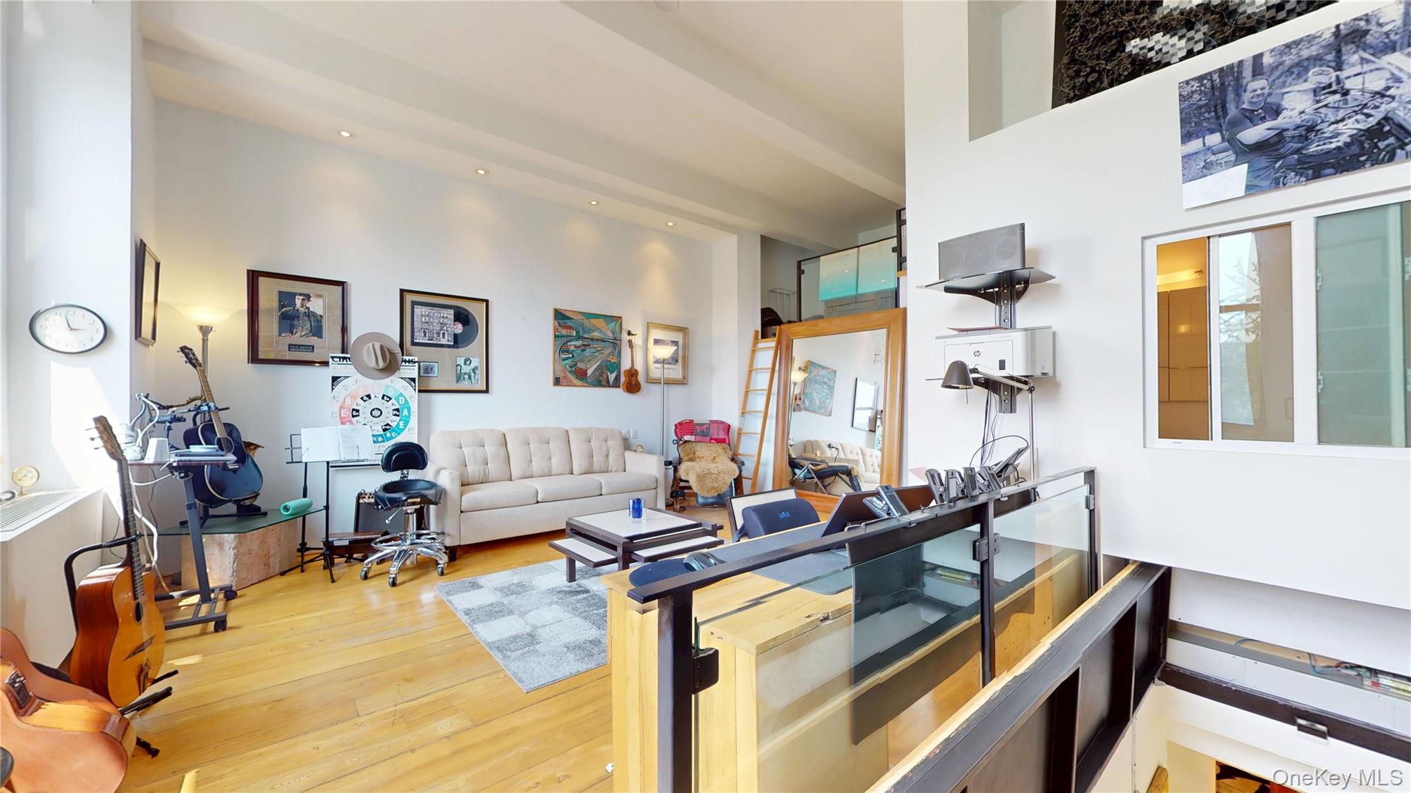 1255 5th Avenue Manhattan, NY 10029 - Photo 13 of 16 Living room featuring light wood finished floors and a high ceiling