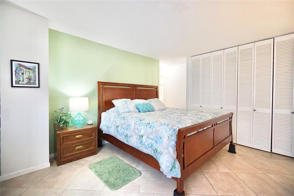 111 Briny Avenue, Unit 2307 Pompano Beach, FL 33062 - Photo 17 of 47 a bedroom with a bed and a window