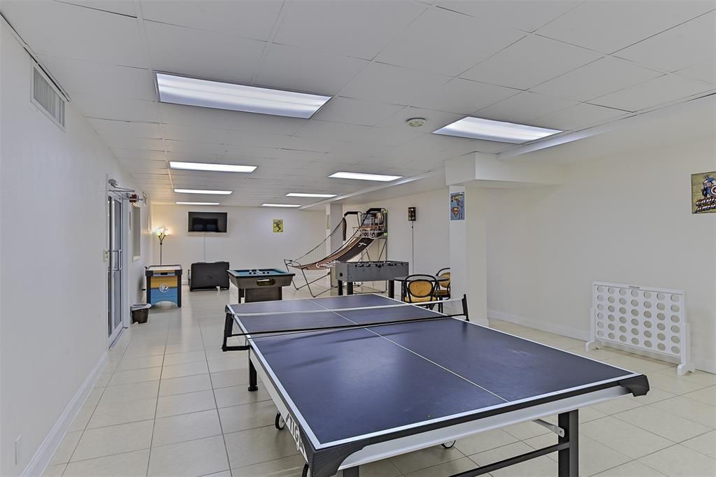 111 Briny Avenue, Unit 2307 Pompano Beach, FL 33062 - Photo 19 of 47 a room with gym equipment