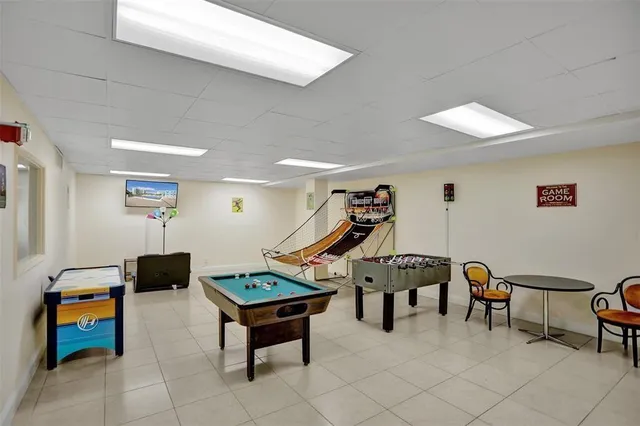a dining room with furniture a rug and wooden floor