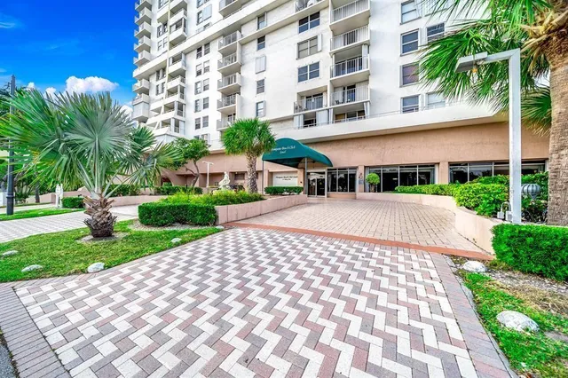 a view of a building with a yard