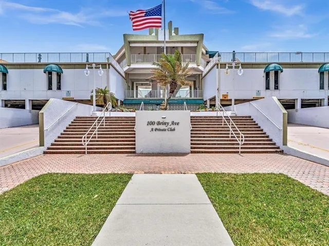 a view of swimming pool and outdoor seating