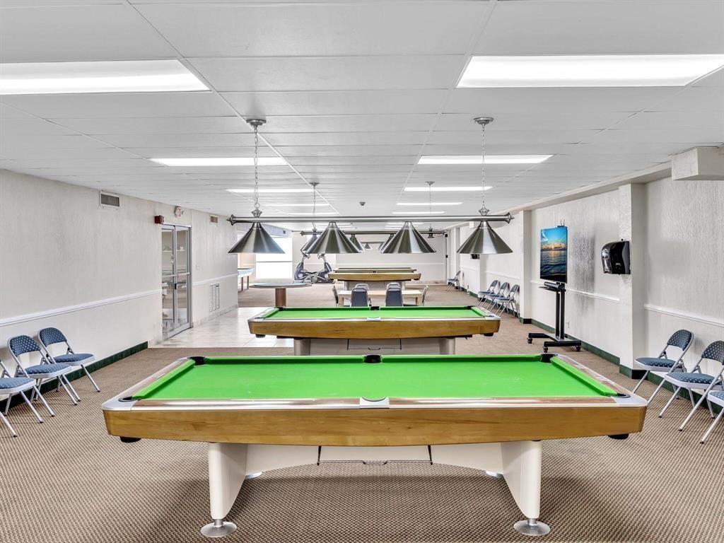 111 Briny Avenue, Unit 2307 Pompano Beach, FL 33062 - Photo 38 of 47 a room with pool table and windows