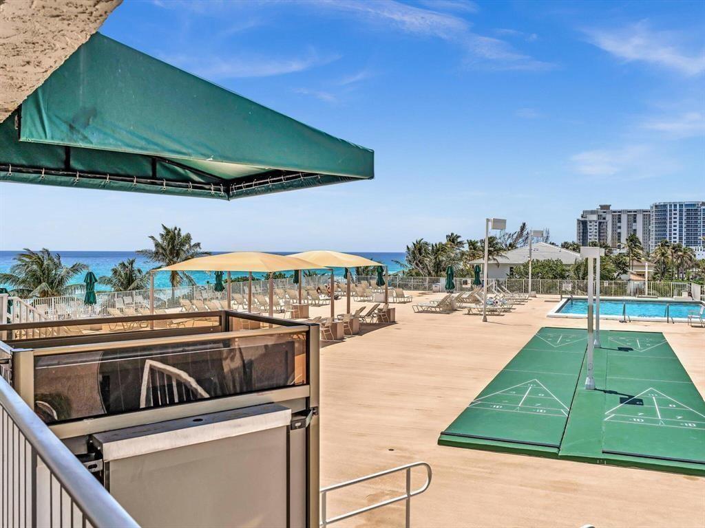 111 Briny Avenue, Unit 2307 Pompano Beach, FL 33062 - Photo 40 of 47 a view of a swimming pool with a patio