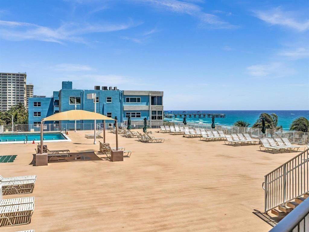 111 Briny Avenue, Unit 2307 Pompano Beach, FL 33062 - Photo 42 of 47 a view of swimming pool with outdoor seating and yard