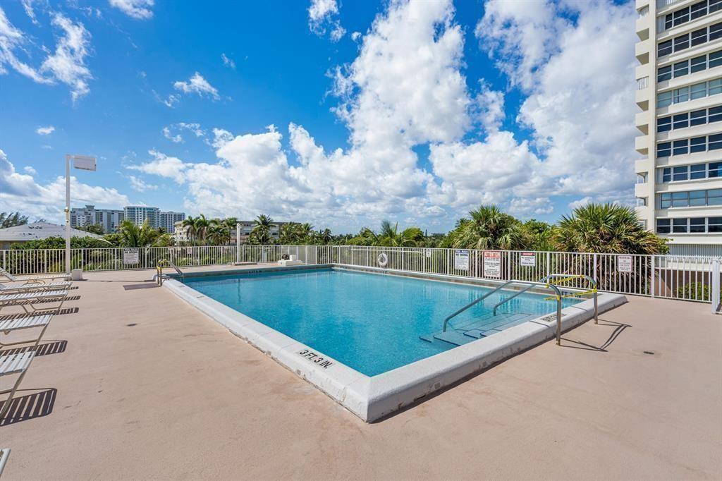 111 Briny Avenue, Unit 2307 Pompano Beach, FL 33062 - Photo 43 of 47 a view of a swimming pool and a terrace