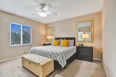 a bedroom with a bed and window