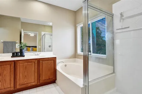 a bathroom with a bathtub and a sink