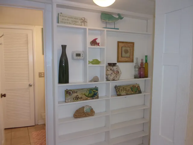 a view of a hallway and dining room