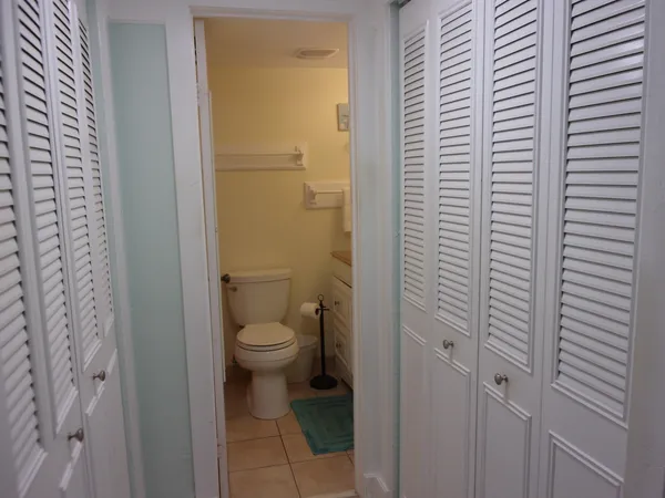 a bathroom with a granite countertop sink a mirror and a shower