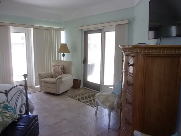 a bedroom with a bed and a table with lamp