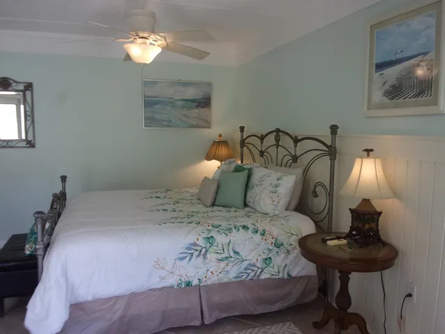 a bedroom with a bed and a television