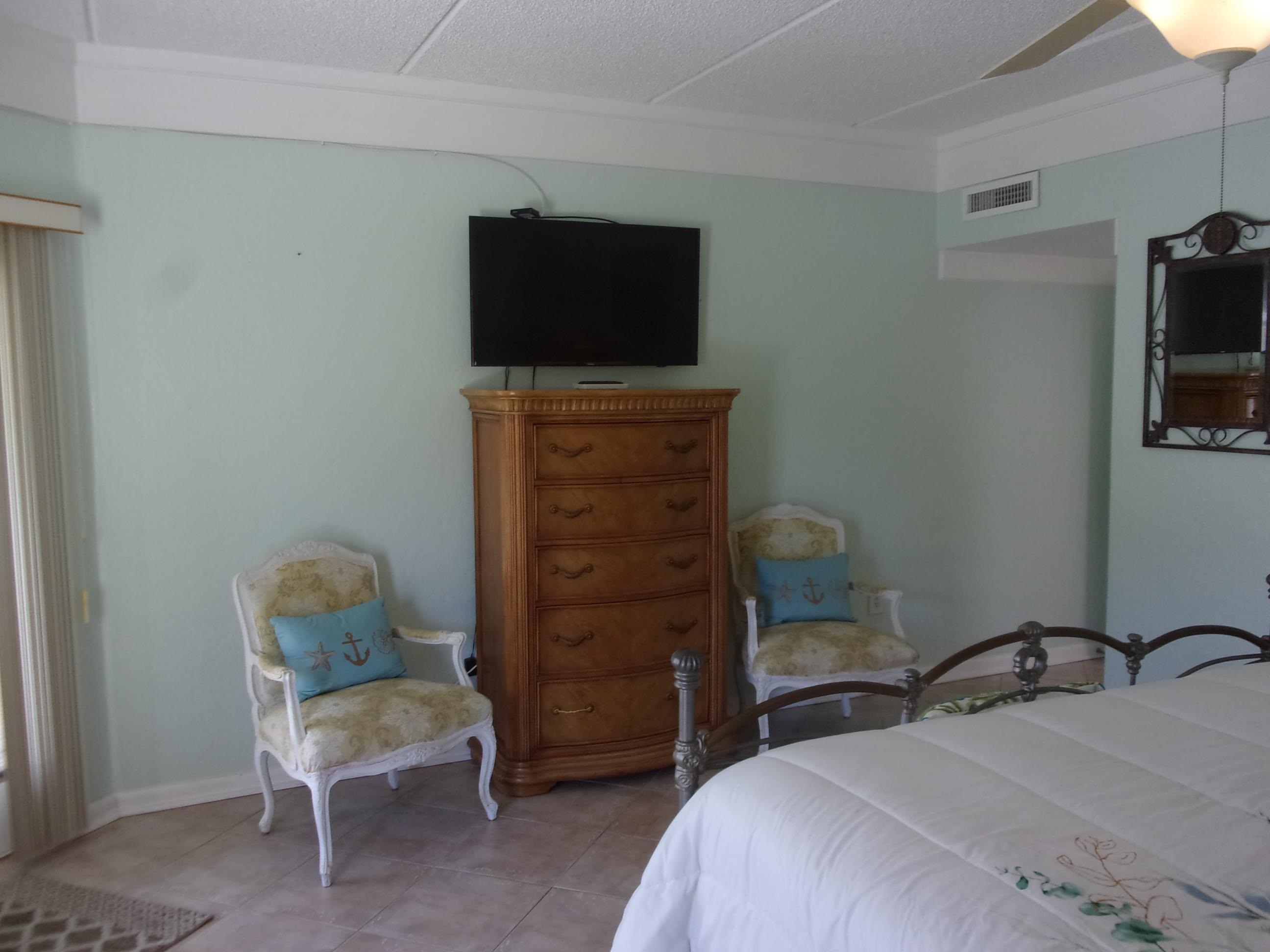 5650 A1A South, Unit B107 St. Augustine, FL 32080 - Photo 37 of 50 a bedroom with a bed and a television