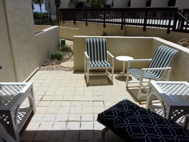 a view of a swimming pool with a patio