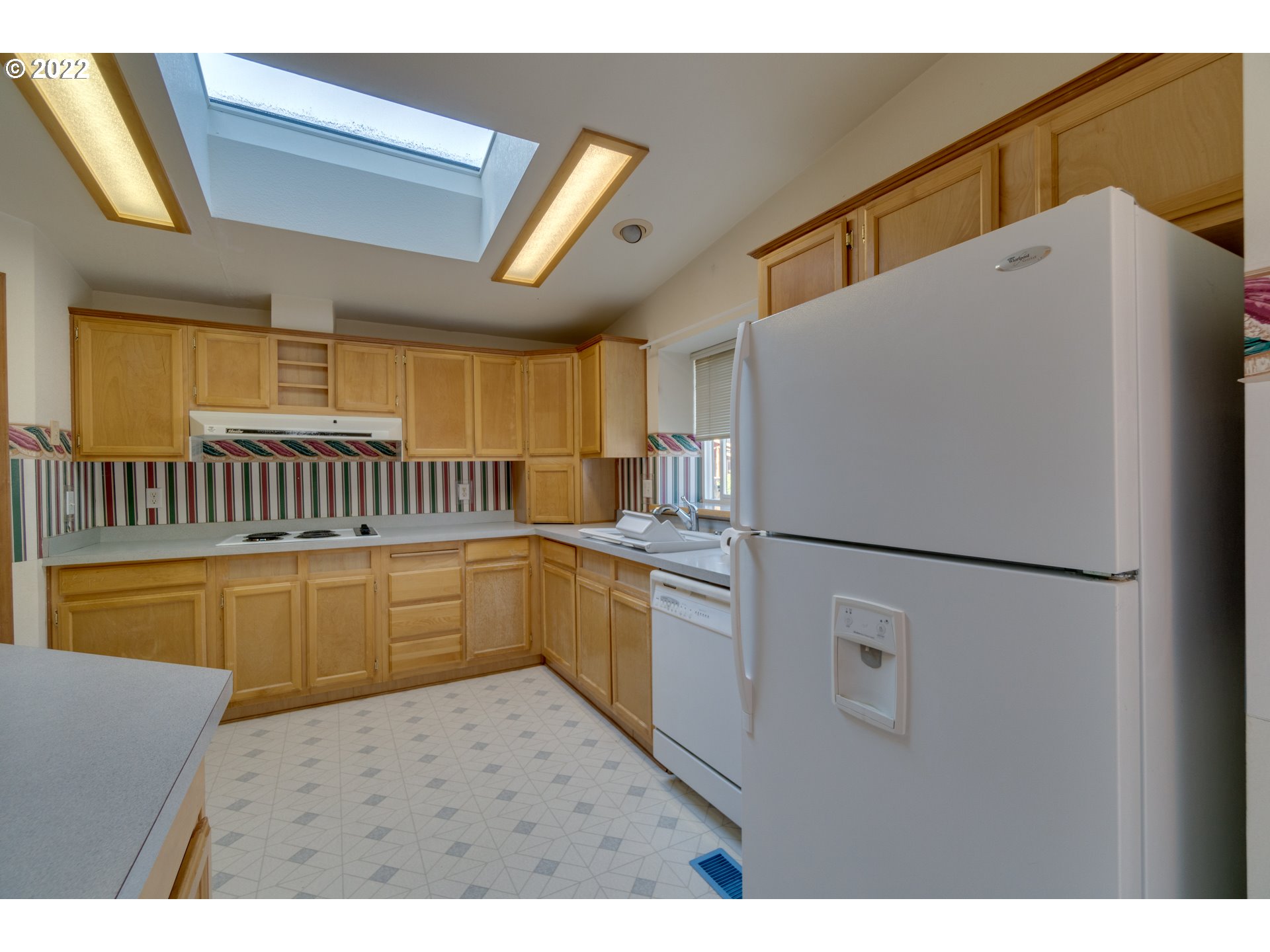 25222 East Welches Road Welches, OR 97067 - Photo 11 of 31 a kitchen with a refrigerator and a sink