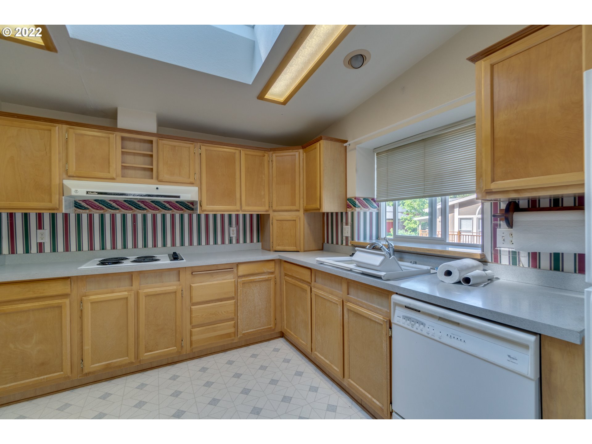 25222 East Welches Road Welches, OR 97067 - Photo 13 of 31 a kitchen with sink cabinets and window