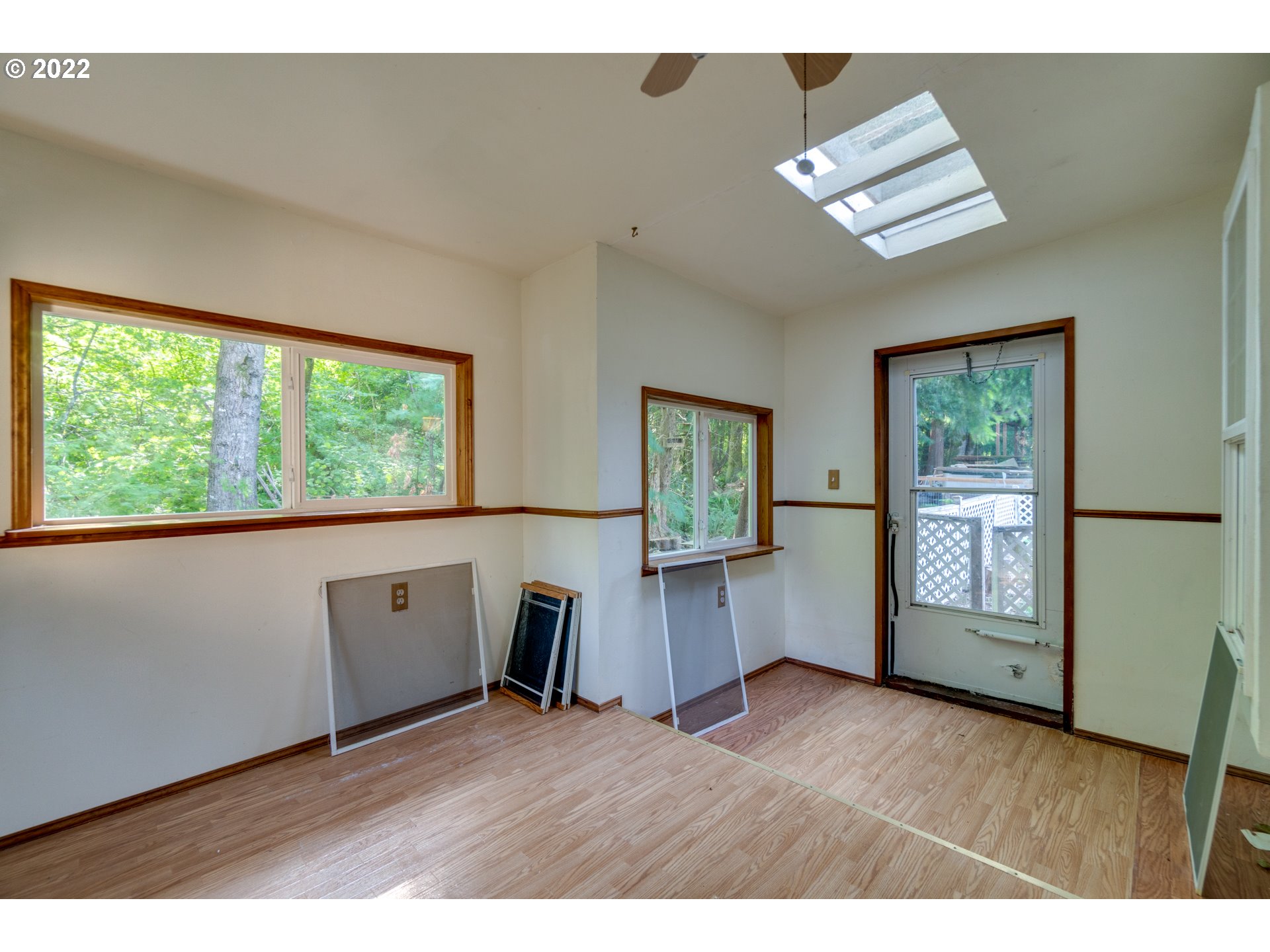 25222 East Welches Road Welches, OR 97067 - Photo 28 of 31 a view of an empty room with a window and wooden floor