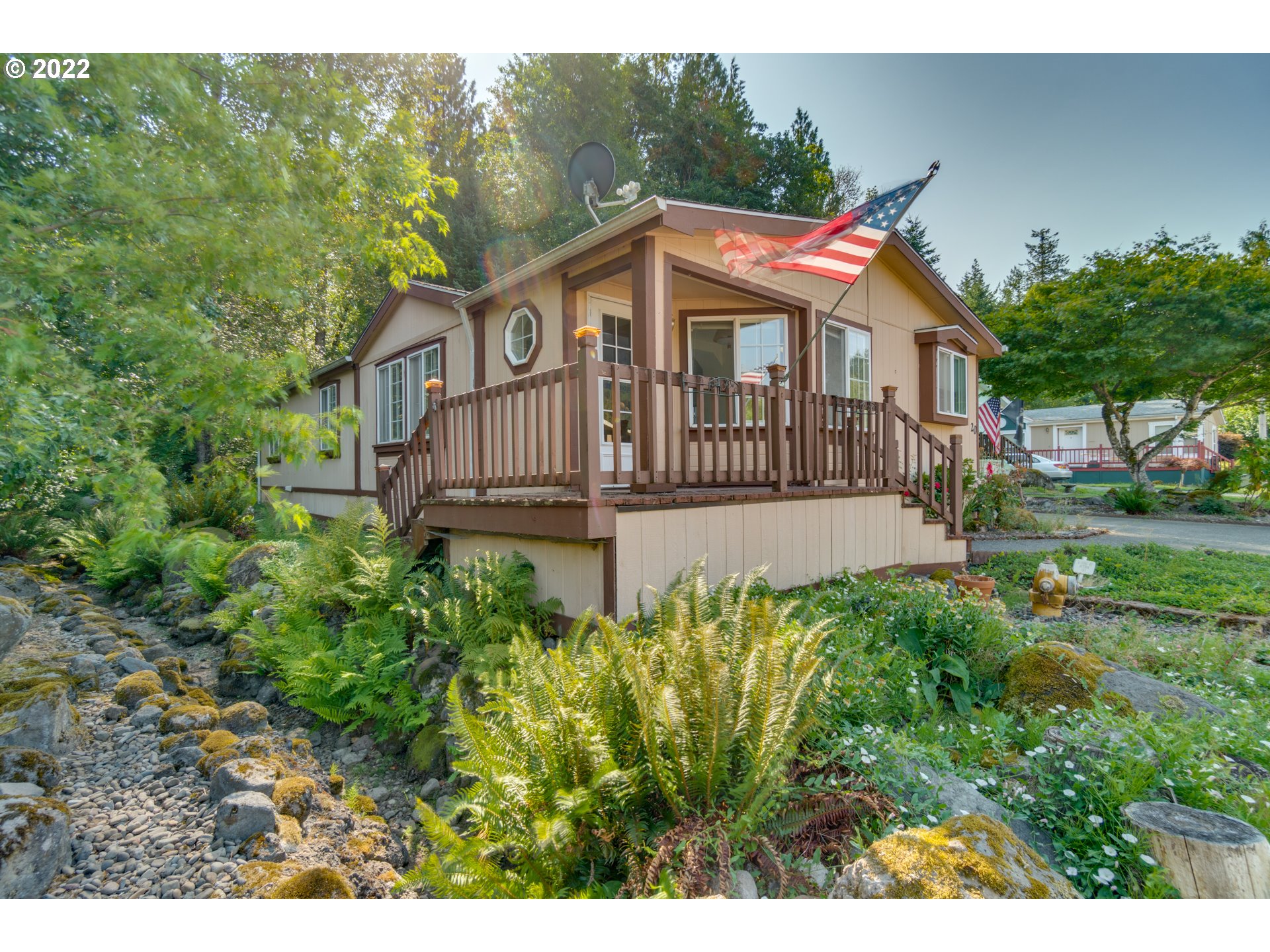 25222 East Welches Road Welches, OR 97067 - Photo 4 of 31 a view of a house with a yard and sitting area