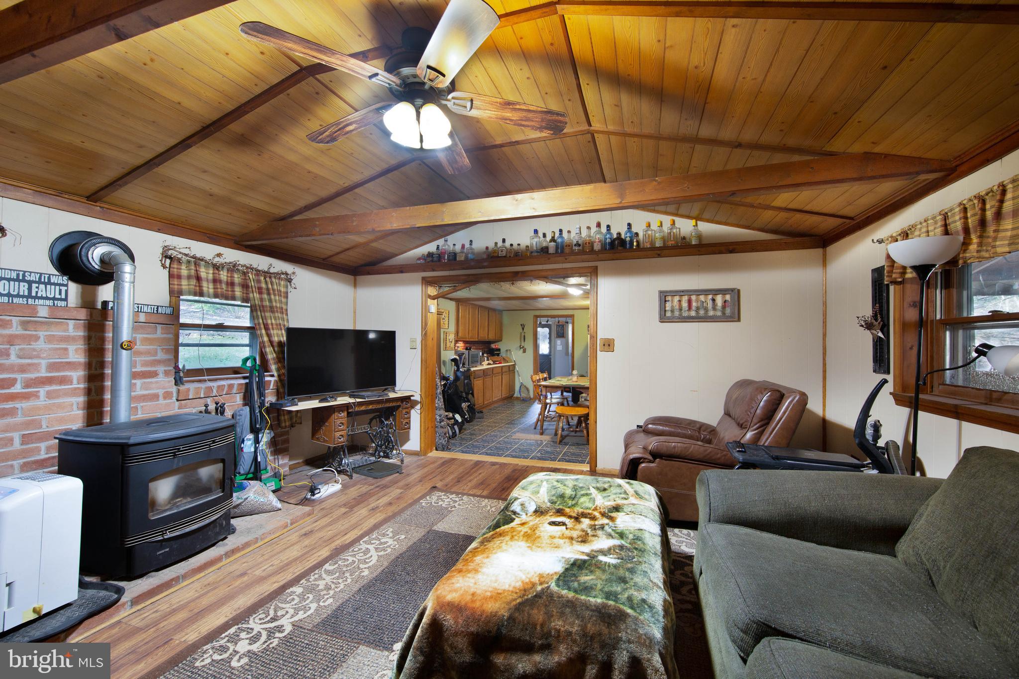 1014 Aubel Road Delta, PA 17314 - Photo 17 of 32 LIVING ROOM WITH PELLET STOVE !!