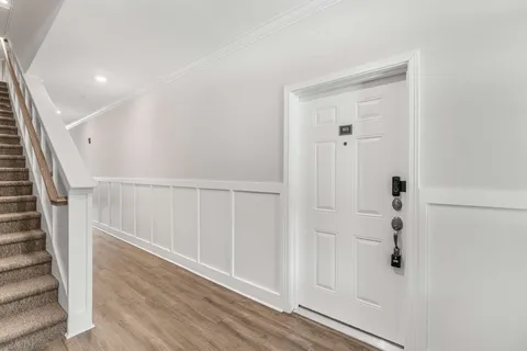 a view of entryway with wooden floor