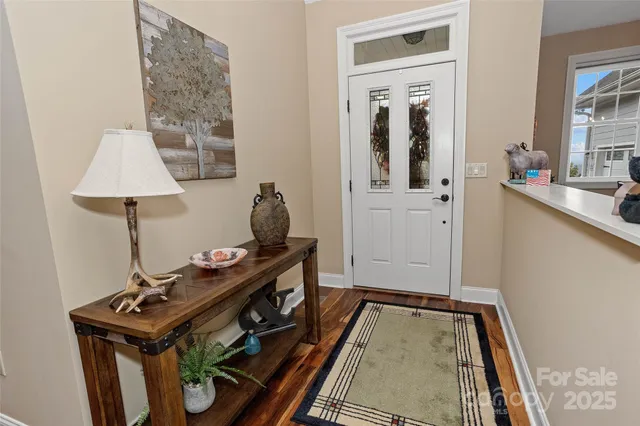 a bedroom with a bed and a television