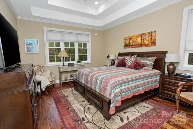a bathroom with a granite countertop toilet a sink and a mirror