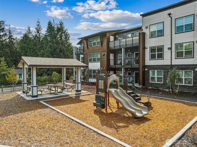 a view of a house with sitting area and furniture