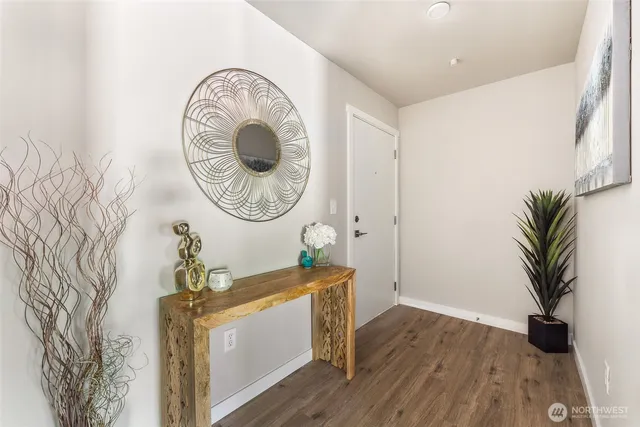a view of a livingroom with furniture and wooden floor