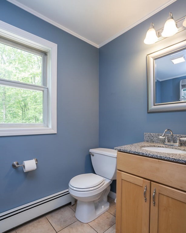 4 Highland Road Williamsburg, MA 01096 - Photo 19 of 42 a bathroom with a toilet sink vanity and mirror