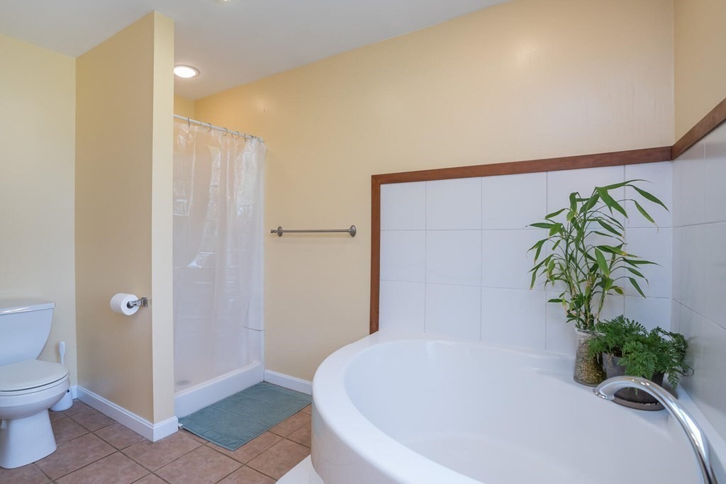 4 Highland Road Williamsburg, MA 01096 - Photo 24 of 42 a white bath tub with a shower