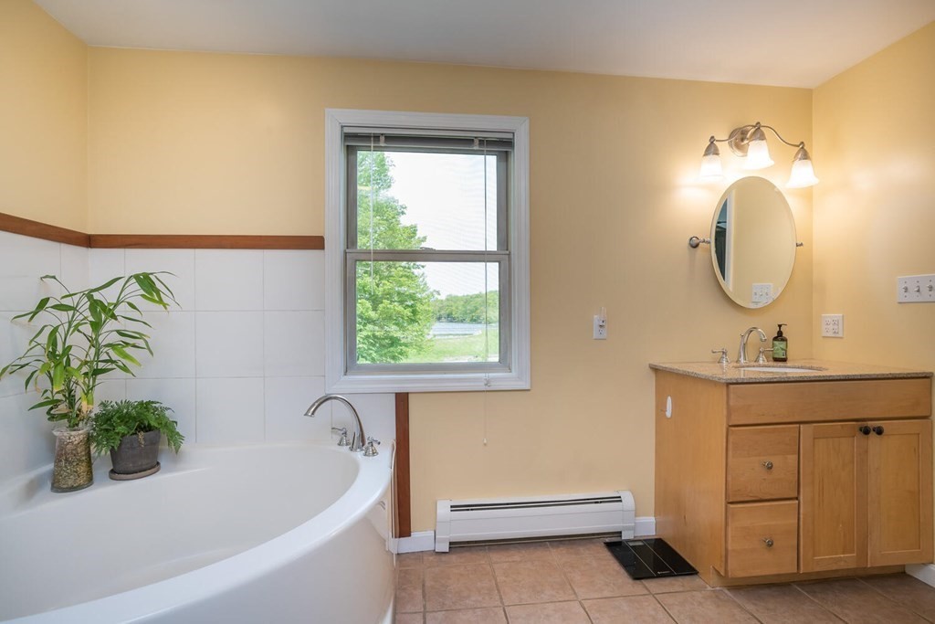 4 Highland Road Williamsburg, MA 01096 - Photo 25 of 42 a bathroom with a tub sink and mirror