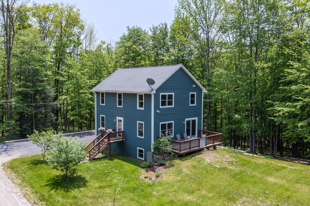 4 Highland Road Williamsburg, MA 01096 - Photo 3 of 42 a view of house with yard entertaining space and large trees