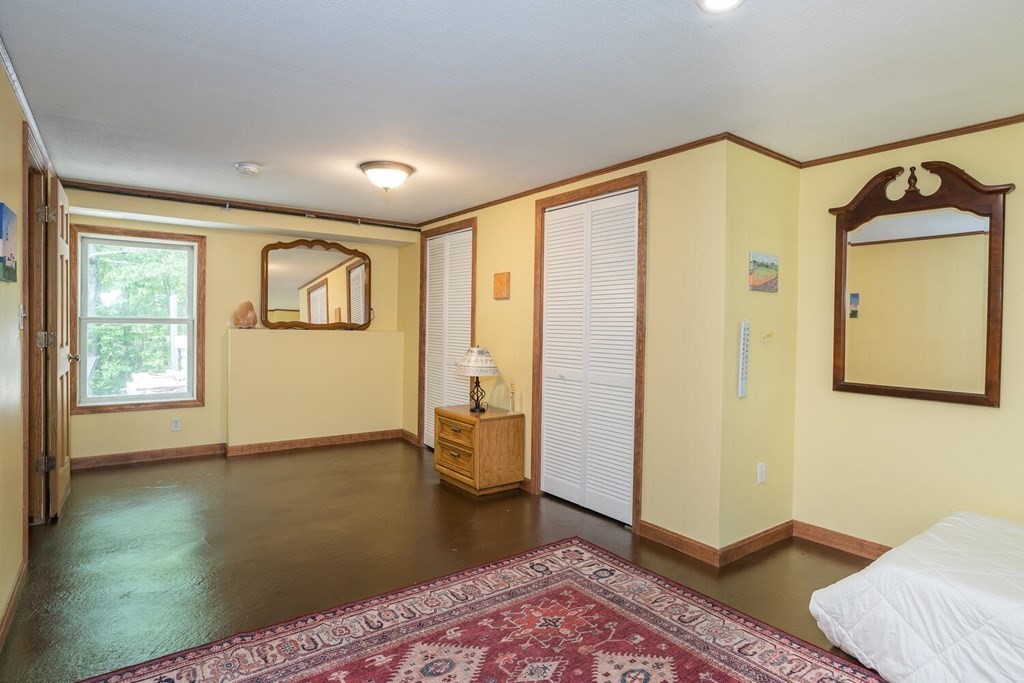 4 Highland Road Williamsburg, MA 01096 - Photo 31 of 42 a view of a bedroom with wooden floor and a window