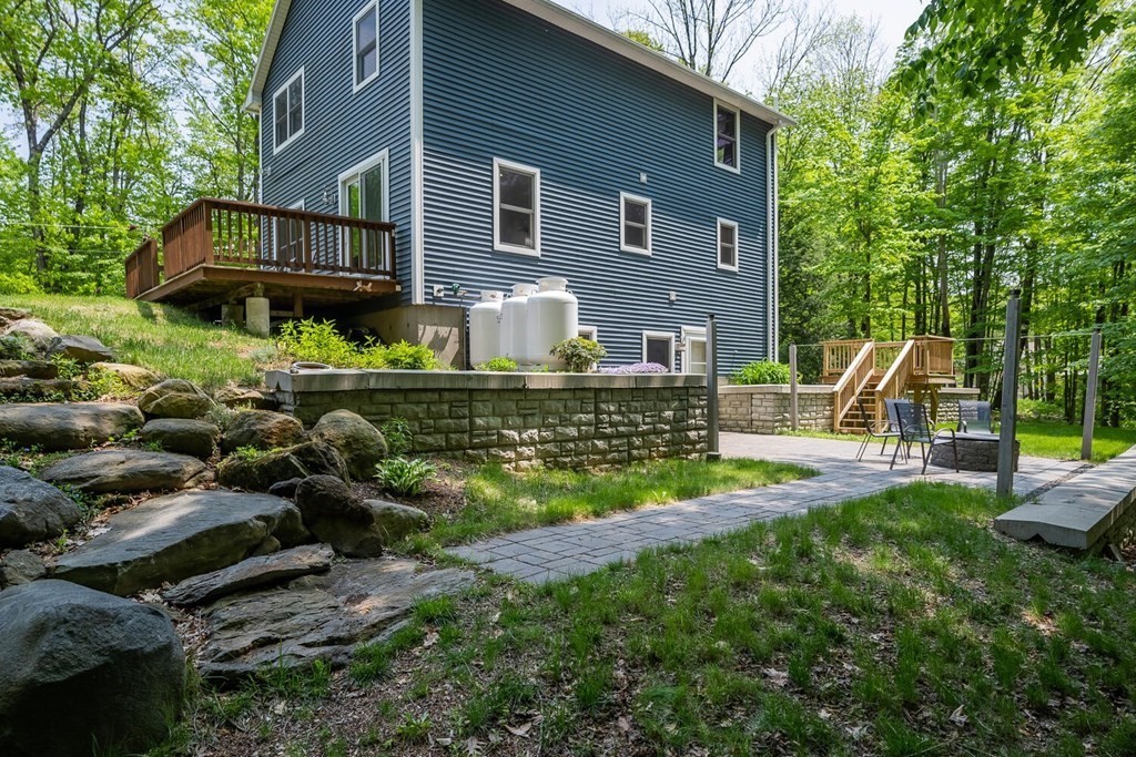 4 Highland Road Williamsburg, MA 01096 - Photo 34 of 42 a view of a house with backyard and sitting area
