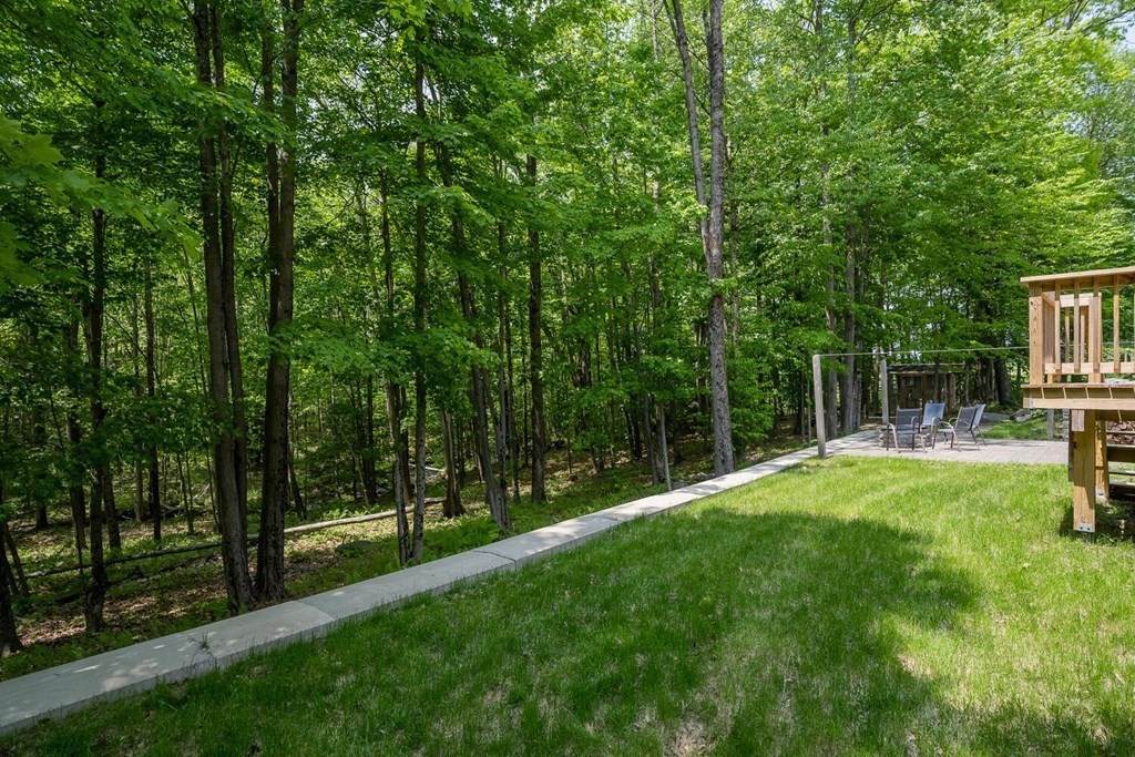 4 Highland Road Williamsburg, MA 01096 - Photo 36 of 42 a view of a backyard with large trees