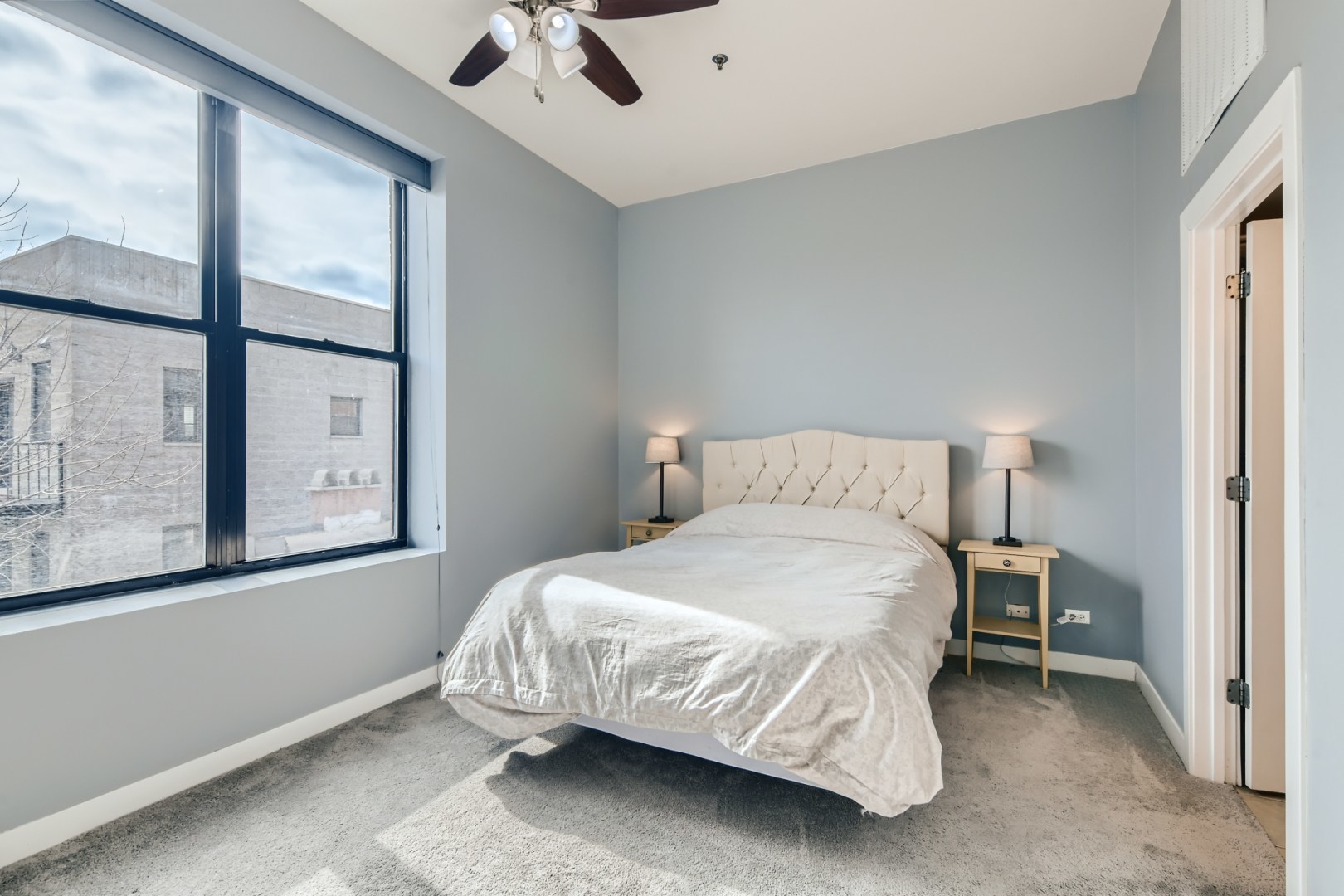 1 South Leavitt Street, Unit 307 Chicago, IL 60612 - Photo 12 of 23 a bedroom with a bed and window