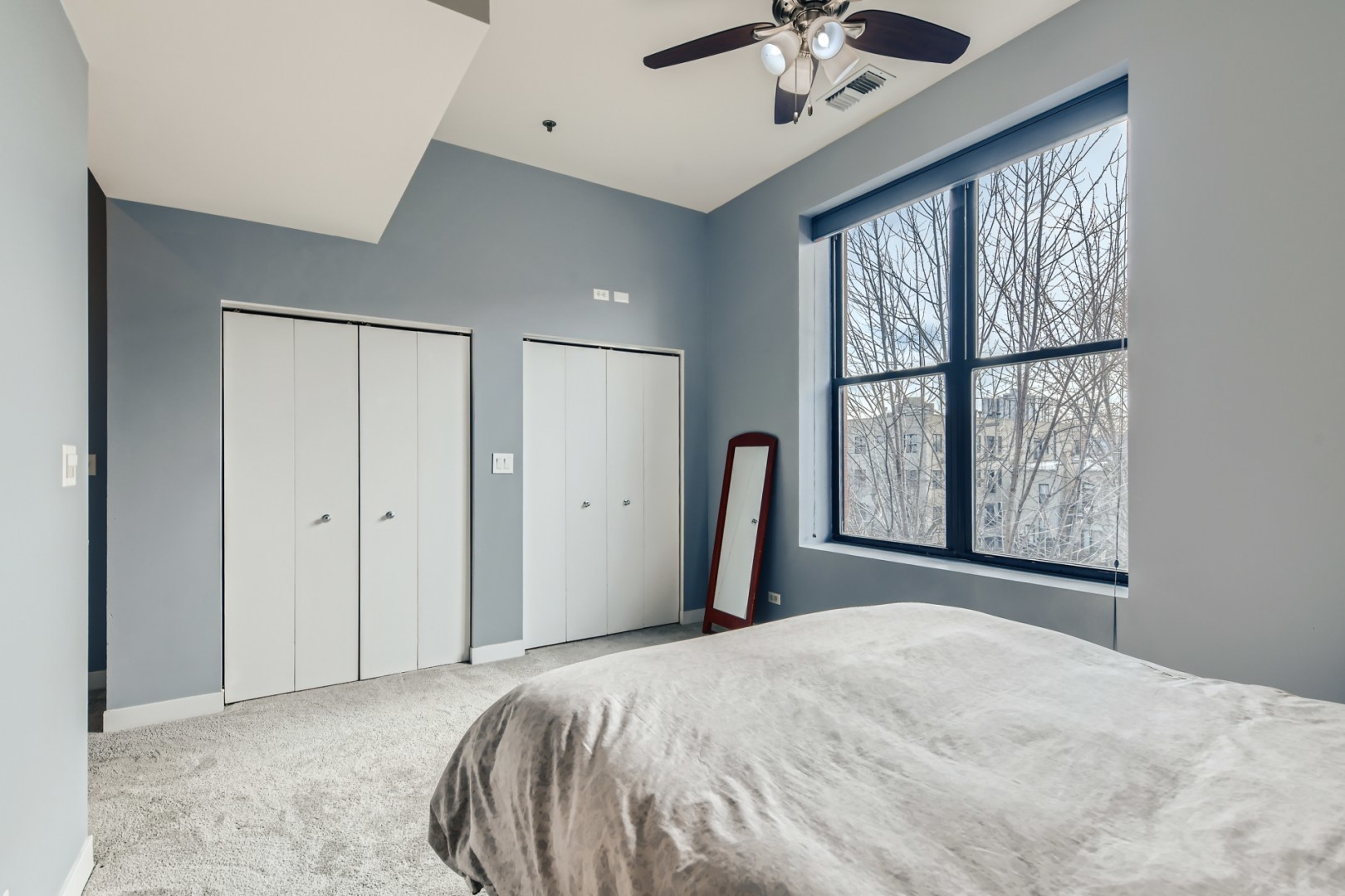 1 South Leavitt Street, Unit 307 Chicago, IL 60612 - Photo 13 of 23 a bedroom with a bed and a large window