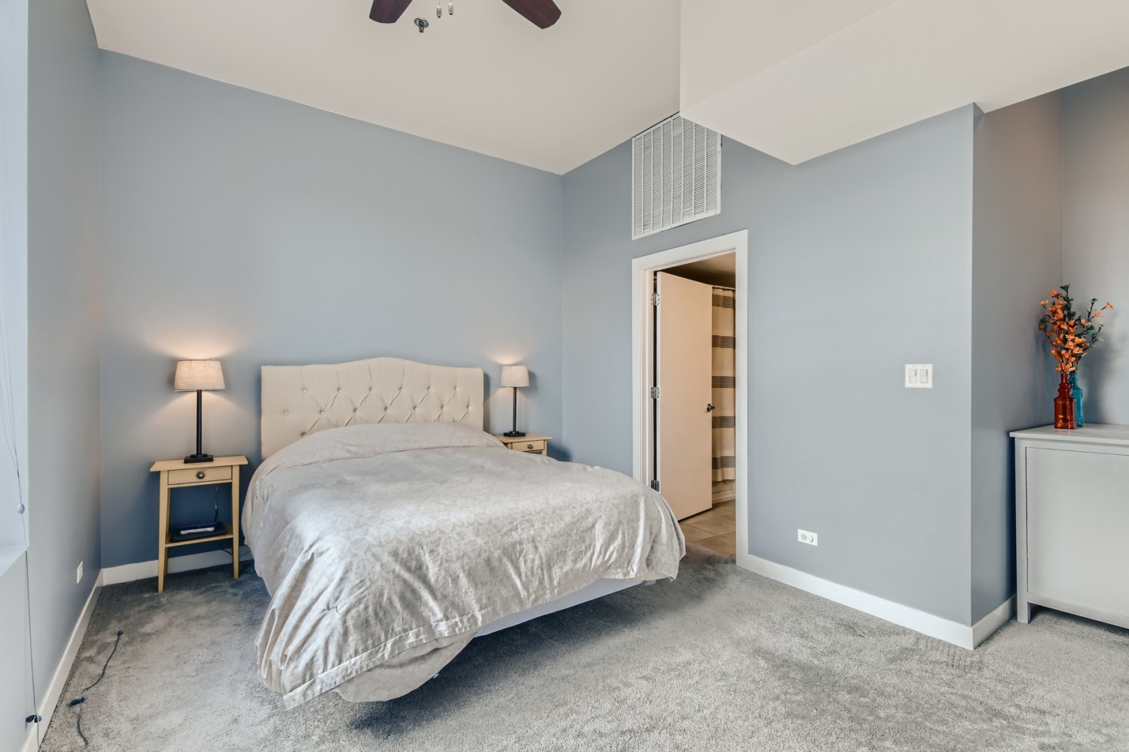 1 South Leavitt Street, Unit 307 Chicago, IL 60612 - Photo 14 of 23 a bedroom with a bed and a mirror