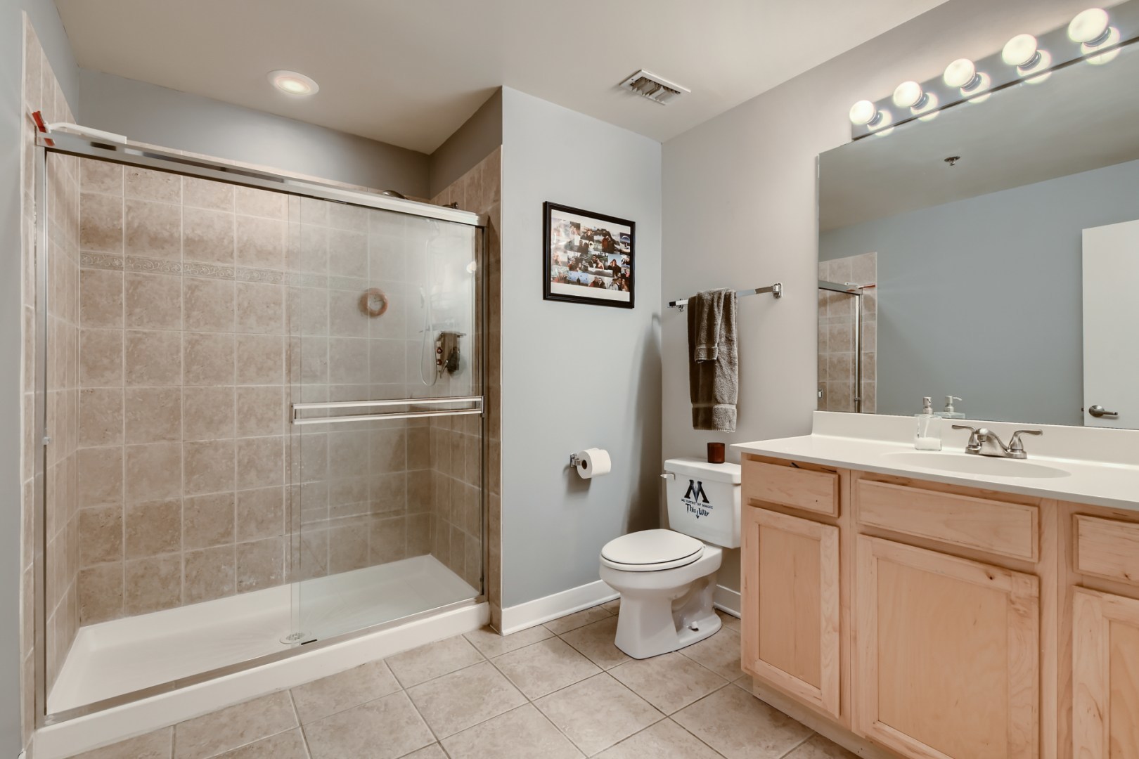 1 South Leavitt Street, Unit 307 Chicago, IL 60612 - Photo 17 of 23 a bathroom with a toilet sink and mirror