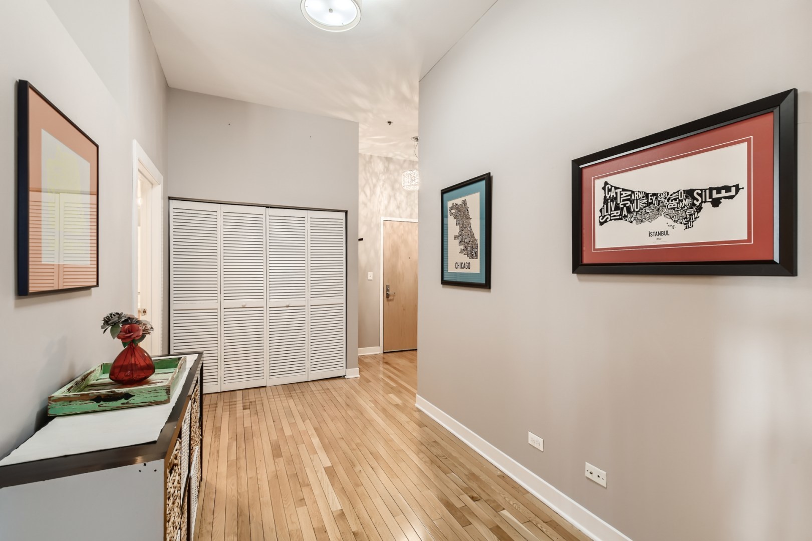 1 South Leavitt Street, Unit 307 Chicago, IL 60612 - Photo 5 of 23 a view of a room with wooden floor and a ceiling fan
