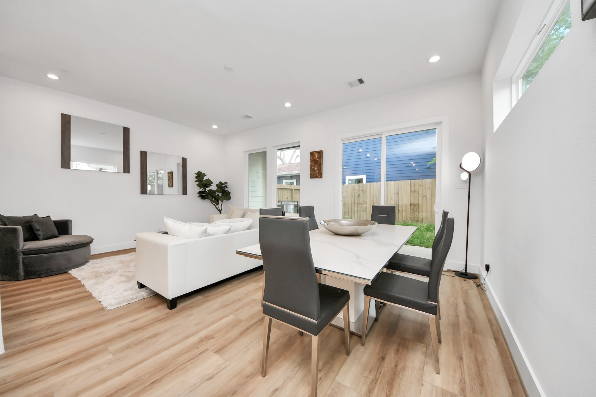 507 Middle Street Houston, TX 77003 - Photo 12 of 48 Discover a stylish dining area seamlessly integrated into a bright, modern living space, featuring sleek furnishings and abundant natural light for a welcoming atmosphere.