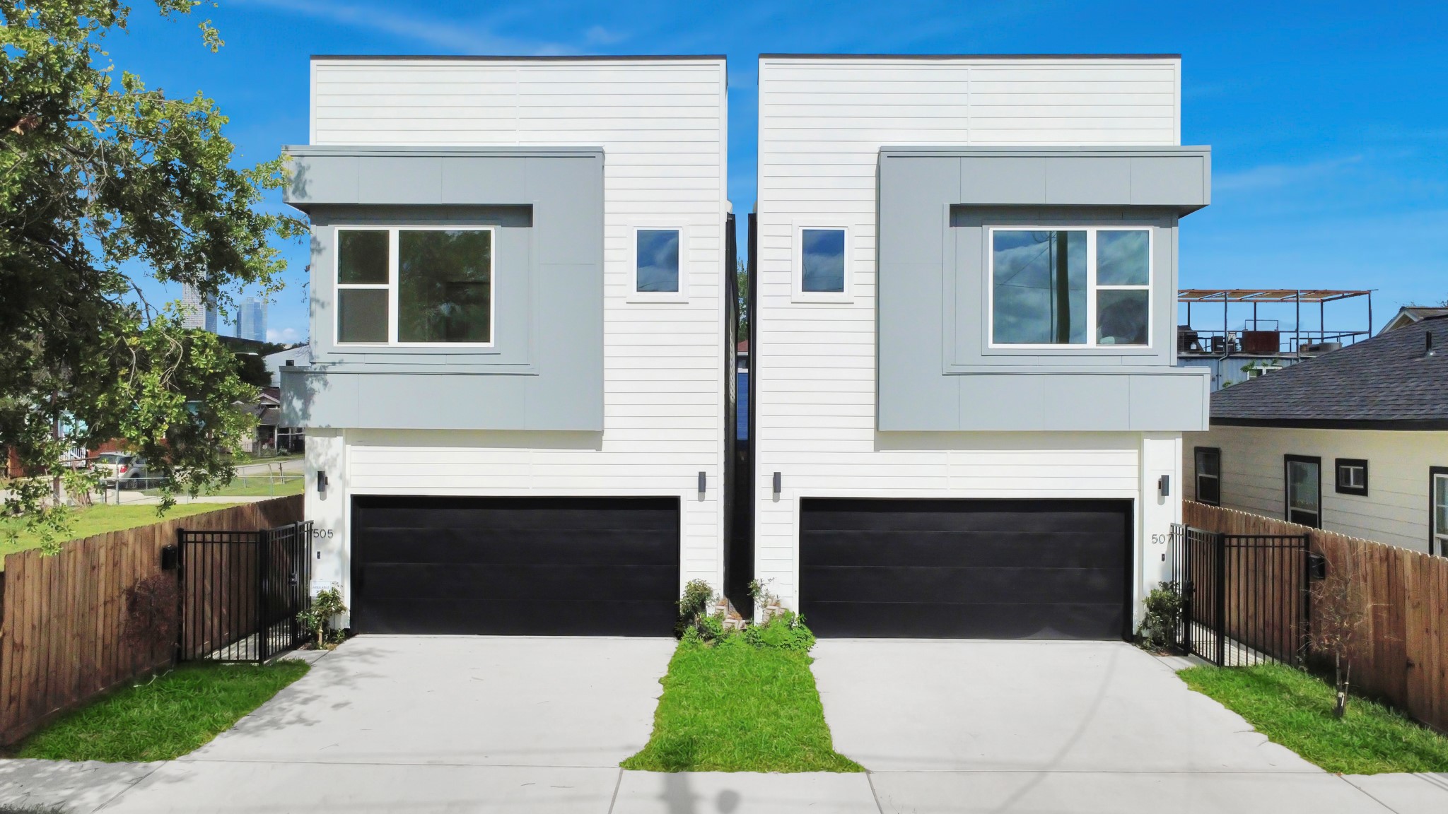 507 Middle Street Houston, TX 77003 - Photo 43 of 48 Discover modern elegance at "Middle Street Manors," featuring sleek, twin contemporary homes with spacious double garages and stylish facades, nestled in a welcoming neighborhood.